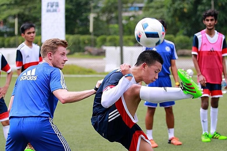 A participant being put through his paces at a coaching clinic run by Premier League side Chelsea yesterday. A total of 16 gamers were chosen for the clinic, which is part of the club's bid to engage the community in Asia.