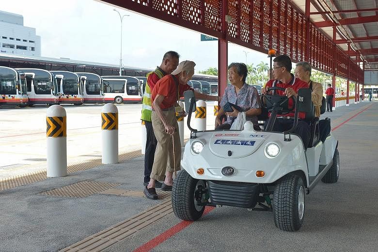 Senior citizens trying out the buggy service at the Woodlands Temporary Bus Interchange on its first day of operations yesterday. The interchange will be in service until 2019, while the Woodlands Regional Interchange undergoes upgrading and an under