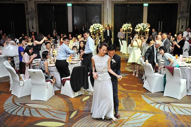 Mr Lee Qianwen, and Ms Stacey Su having their first dance during their wedding party at W Singapore Sentosa Cove on March 5. After paying for a menu upgrade, they spent more than $200 on each of their 340 guests.