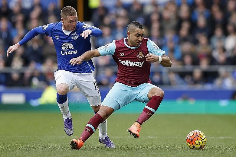 West Ham fans hail Dimitri Payet (right) as as the closest thing in the East End of London since Paolo di Canio plied his trade and his wizardry there more than a decade ago.