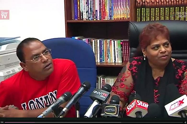Ms Selvi with Mr Ramesh at the news conference on Saturday. She apologised for linking Mr Najib to her husband's death, but insisted her husband's allegations about the PM's involvement in the murder were true.