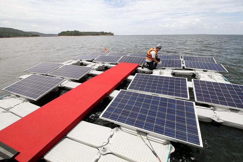 Floating solar panels atop the artificial lake at Balbina dam, whose power station now produces only a fraction of the output originally planned. Engineers aim to eventually crank out 300MW with the new panels.