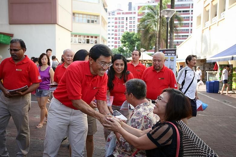 Dr Chee greeting a resident during the SDP's walkabout in Bukit Batok yesterday. He said the party hopes other opposition parties will not contest the seat as it is "looking forward to a one-on-one contest with the PAP".