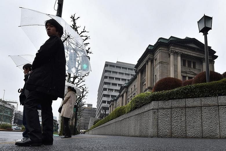 Tokyo was part of a global rally yesterday, with shares going up 1.7 per cent as the Bank of Japan (above) began its two-day meeting.