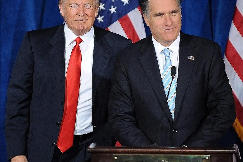 Then Republican presidential candidate Mitt Romney (left) addressing supporters after being endorsed by Mr Trump in Las Vegas in 2012. Mr Romney will make his first venture into the 2016 campaign alongside Mr Kasich in Ohio.