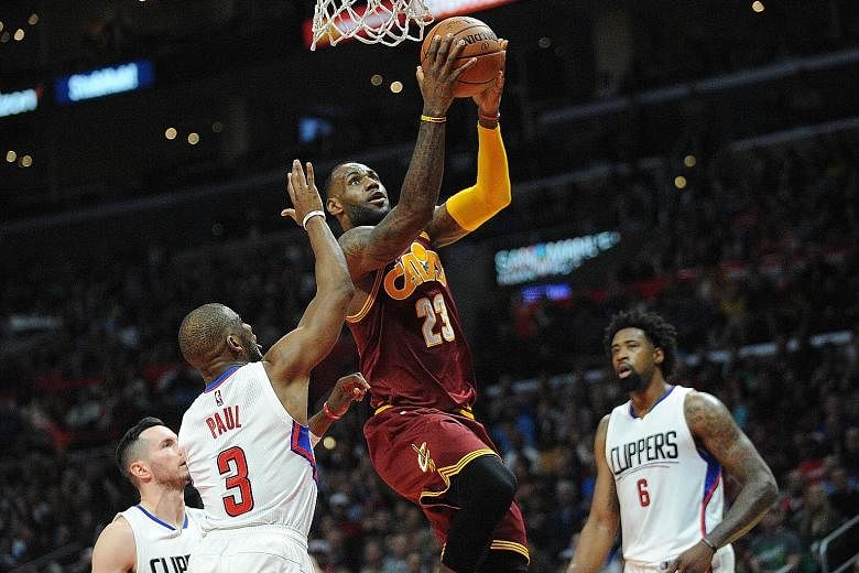 Cleveland Cavaliers star LeBron James scoring two of his game-high 27 points against the Los Angeles Clippers. The Cavaliers have won three straight games with one to go in their four-game Western Conference road trip, and have beaten both the Clippe