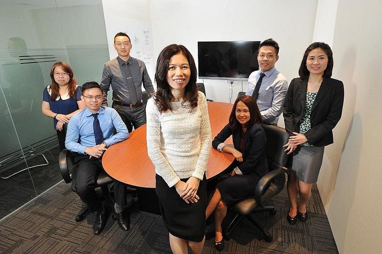 The team from KYC Group - (from left) accounts supervisor Ang Swee Hoon, senior auditor Kam Mau Thai, auditor Zheng Xu Tao, founder Vivienne Chiang, assistant accounts manager Ashley Tan, associate consultant Nicholas Ngai and audit manager Fatima Di