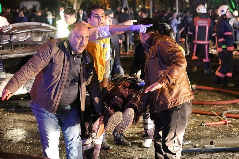 An injured person being carried on a stretcher at the bombing scene in Ankara on Sunday. The attack has raised questions over the Turkish government's ability to protect its citizens.