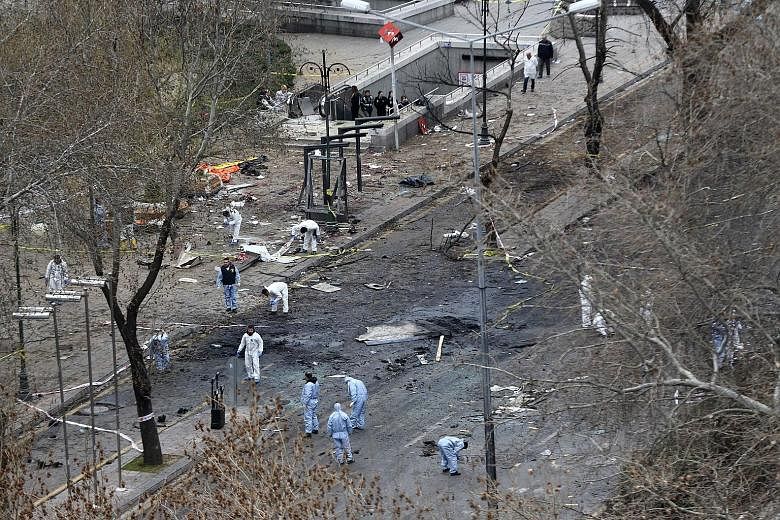 Forensic experts at the scene of the explosion yesterday. On Sunday, a car filled with explosives blew up near the busy Kizilay Square in central Ankara, killing at least 37 people. It is the third such attack to hit the Turkish capital in five month