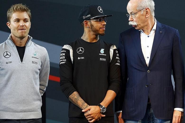 Daimler AG chief Dieter Zetsche with Lewis Hamilton (centre) and Nico Rosberg at a news conference about the Mercedes' 'Motorsport Kickoff 2016'. Red Bull team principal Christian Horner has labelled the Mercedes duo's rivalry "extremely mild" compar