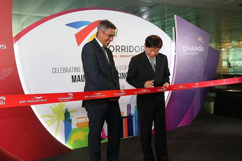 Mr Duval and Singapore Transport Minister Khaw Boon Wan launching the Asia-Africa Corridor at Changi Airport yesterday.