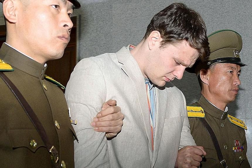Warmbier, a University of Virginia student, being taken out of North Korea's top court after being sentenced. He was given 15 years hard labour for what Pyongyang called hostile acts against the country.