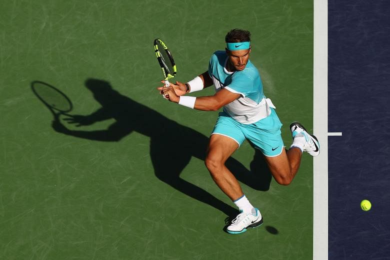 Rafael Nadal, stretching for a backhand return to Fernando Verdasco, avenged his Australian Open loss to his fellow Spaniard, winning 6-0, 7-6 (11-9) at Indian Wells.