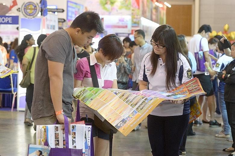Visitors at a National Association of Travel Agents Singapore travel fair. With more people going overseas and greater awareness of the need for coverage, the travel insurance segment has seen rapid growth, says the General Insurance Association.