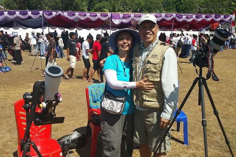 A picture of last Wednesday's total solar eclipse taken by Mr Koh from the Indonesian island of Tidore. Mr and Mrs Koh woke up before 5am to catch the event. Mrs and Mr Koh on Tidore island after the solar eclipse last Wednesday. The sultan of Tidore