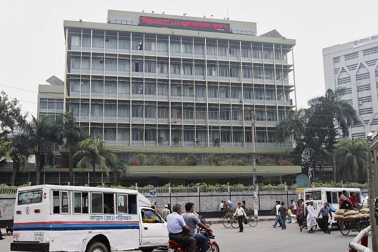 The Bangladesh central bank building in Dhaka. The country's top central banker has resigned over the theft. Investigators in the Philippines are now looking into how the money came to be transferred to the country.