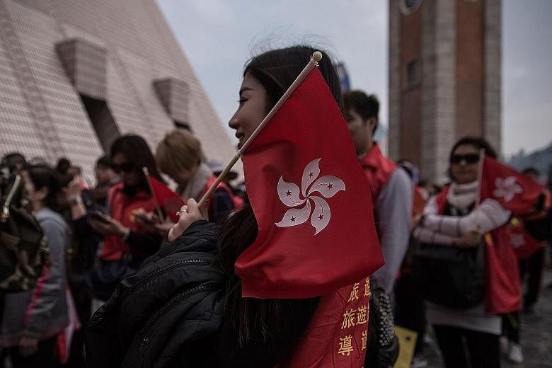A rally on Feb 14 in support of how the police handled the Mongkok riots on Feb 9. Political conflicts in Hong Kong could be taking the focus away from the need to focus on economic imperatives that will ensure its future as a super-connector linking