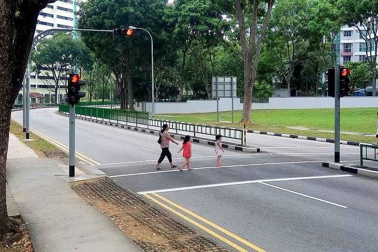The lights were green in Mr Li's favour when he was knocked down by a cab driver in 2011 at the crossing in Bukit Batok West Avenue 5 (above). In 2014, the High Court found the driver fully to blame for the accident.