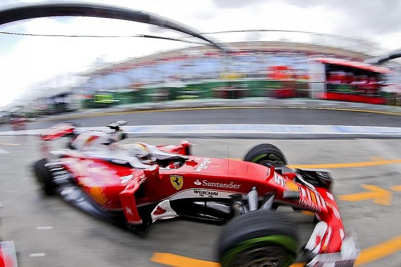 Sebastian Vettel of Ferrari in yesterday's first practice for the Australian Grand Prix. He did not post a time in gusty winds but was eighth quickest in the second session. Current world champion Lewis Hamilton topped both timesheets.