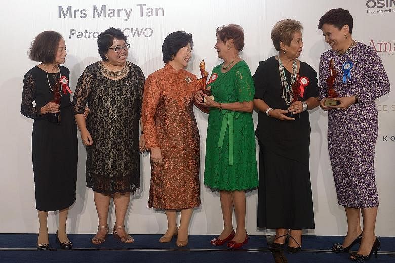 Fourteen women were inducted into the Singapore Women's Hall of Fame last night in recognition of their contributions to Singapore and beyond. Mrs Mary Tan (centre), wife of President Tony Tan Keng Yam and patron of the Singapore Council of Women's O