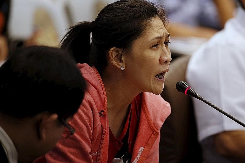 RCBC branch manager Deguito testifying at a Senate hearing on the heist on Thursday. She had transferred the stolen US$81 million to a remittance firm despite notice from regulators in New York and a stop-payment order from her bank's head office.