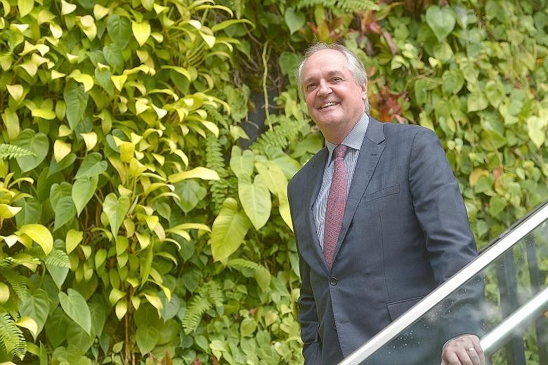 Mr Paul Polman (above), Unilever's chief executive, along with Mr Adams, former Pratt & Whitney president, received the Public Service Star (Distinguished Friends of Singapore) award. Both men "chose to make Singapore a principal base for the businesses t