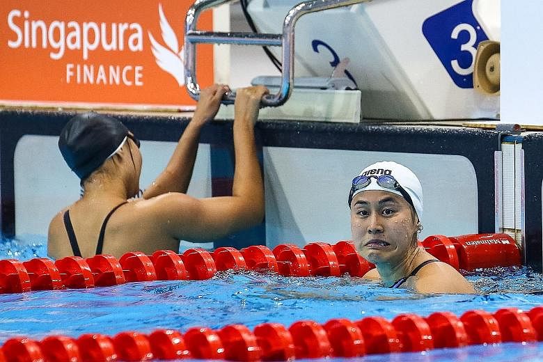National swimmer Quah Ting Wen reacts in the pool after the 50m freestyle final during the Singapore National Age Group Swimming Championships yesterday. While the 23-year-old missed the Olympics 'A' qualifying mark of 25.28sec, her coach retains hop