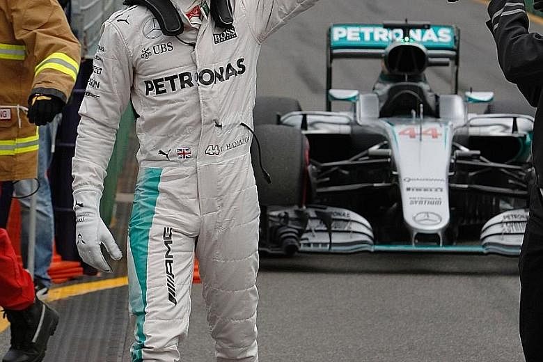 Mercedes driver Lewis Hamilton giving the fans a thumbs-up sign at Melbourne's Albert Park circuit after he qualified in pole position yesterday for the Australian Grand Prix. Toto Wolff, the head of Mercedes Motorsport, said the controversial qualif