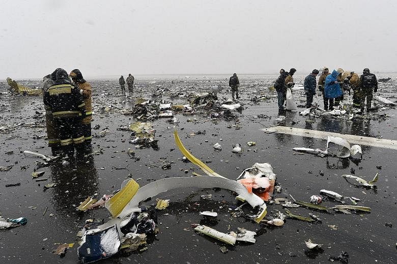 The Boeing 737 landed about 250m short of the start of the runway amid strong winds and heavy rain at Rostov-on-Don airport, erupting in a huge fireball as it crashed and scattering debris across a wide area. Investigators say the two black boxes hav