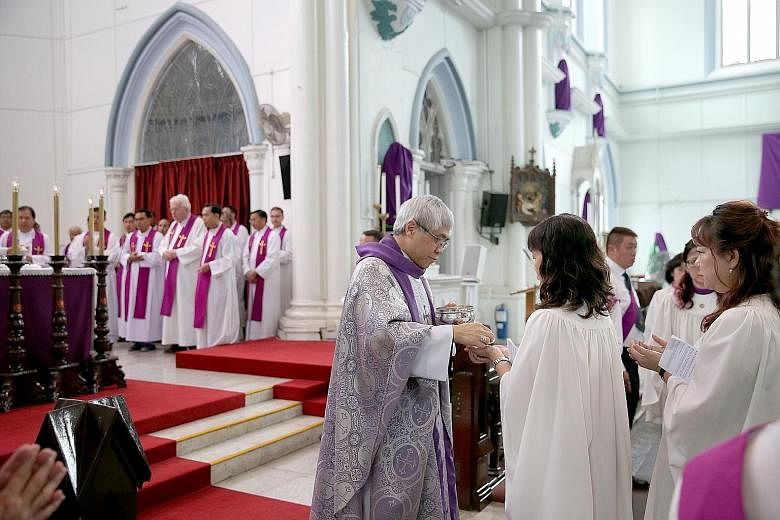 Archbishop William Goh celebrating mass at St Joseph's Church in Victoria Street. The Catholic Church said traditional religions have been slow to engage young people and help them appreciate their faith.
