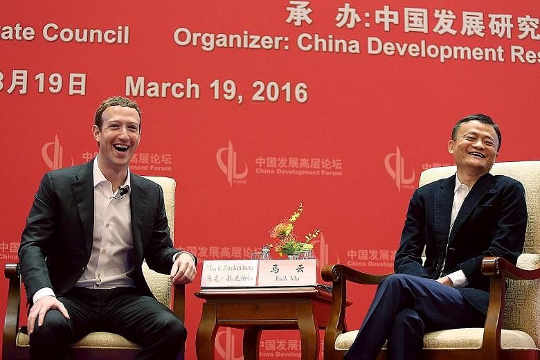 Facebook's Mr Mark Zuckerberg and Alibaba's Mr Jack Ma at the China Development Forum in Beijing last Saturday. Their conversation was one of Mr Zuckerberg's many moves over the weekend that drew local headlines and captivated the online audience in 