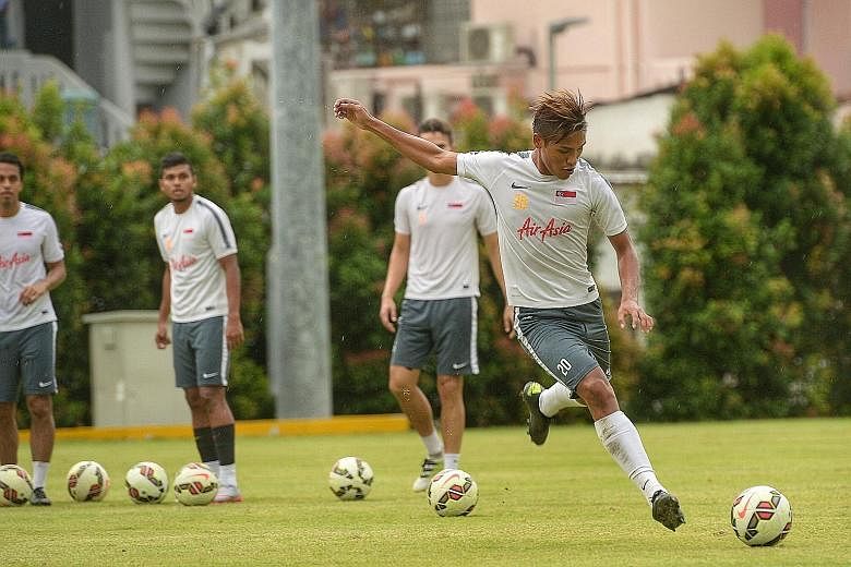Fully fit and brimming with confidence after his brace for Home United, Khairul Nizam (No. 20) puts everything on the line at a training session for the national squad before the friendly game against Myanmar and the World Cup qualifier in Teheran ag