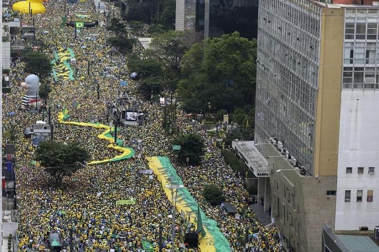 Brazilians rallying in Sao Paulo earlier this month to express support for investigations into a major corruption scandal at state oil company Petrobras.