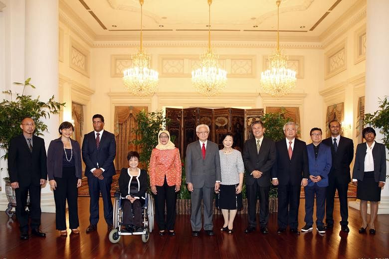 President Tan presided over the ceremony to appoint the NMPs at the Istana yesterday. The NMPs were picked by a select committee chaired by Speaker of Parliament Halimah Yacob. Pictured are (from left): Prof Randolph Tan, Ms Kuik Shiao-Yin, Mr Ganesh Raja