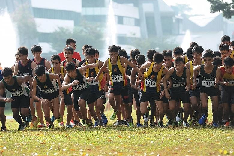 The flag-off for the A Division race, which Isaac Tan (1014) of ACS(I) won in 16min 15.07sec on the 4.6km course at Bedok Reservoir.