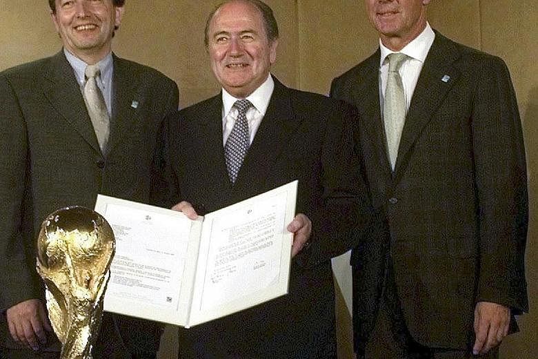 A 1999 file photo of (from left) Wolfgang Niersbach, then a press officer and future head of the German FA, in Zurich with Sepp Blatter and Franz Beckenbauer, head of the bid committee for the 2006 World Cup.