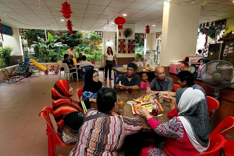 Many residents, young and old, have made an informal second home of the void deck of Block 603, Yishun Street 61, where they gather regularly to chat and eat.