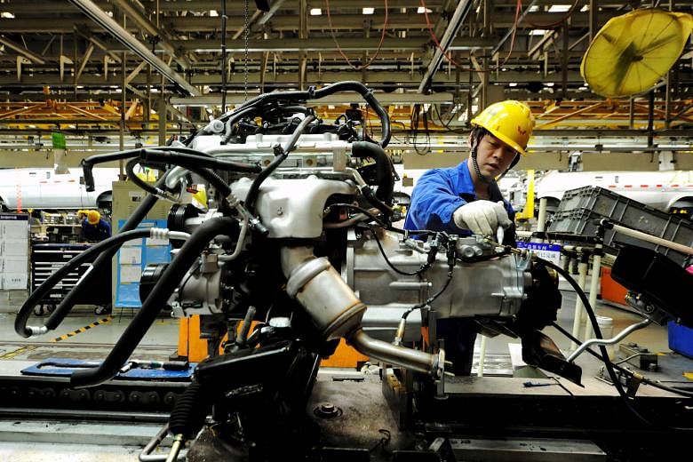An automobile factory in China. Latest government data shows improving economic conditions in China, with fixed-asset investment rising and capital outflows moderating. 