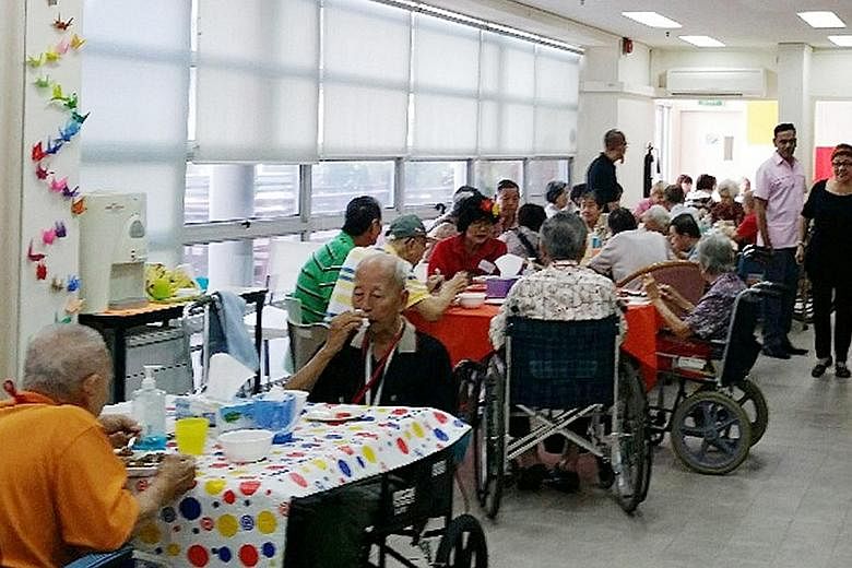 Samsui Supplies and Services staff and volunteers serving meals at the HCA Hospice Care headquarters last year. Samsui, a subsidiary of the Soup Restaurant Group, provides 2,000 meals a day to the needy, usually for free or at a minimal cost of about