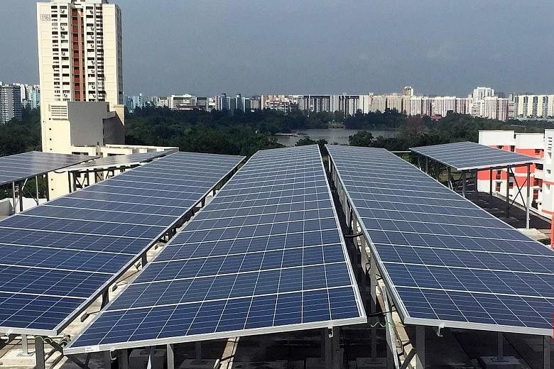 Solar panels atop an HDB block in Jurong. Once a swampland, the area has become a test bed for multiple technologies in recent years, like using solar energy to power common-area services like lights and lifts. An artist's impression of the Jurong In