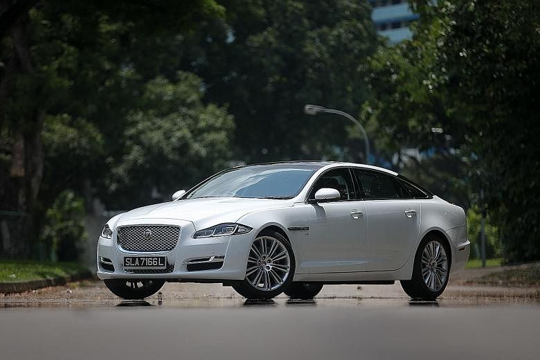 The Jaguar XJ 3.0 comes with a panoramic glass roof (above) and four-zone climate control that can be adjusted from the back seats (below).