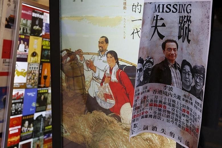 A printout of Mr Lee and his four colleagues, all of whom went missing in recent months, outside a bookstore in Causeway Bay, Hong Kong, in January. The four colleagues are now under criminal investigation in the mainland, linked to the trading of il