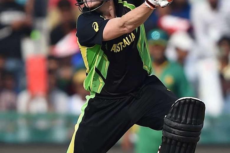 (Above) Australian captain Steve Smith hit 61 to rescue his side from a shaky start after the loss of three early wickets. 