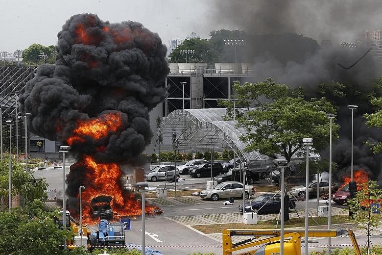 Two cars burst into flames outside the Singapore Sports Hub on April 30 last year in a staged "terror attack" to test the response of the country's emergency services. Around 35 per cent of those surveyed wondered if citizens had the heartware to dea