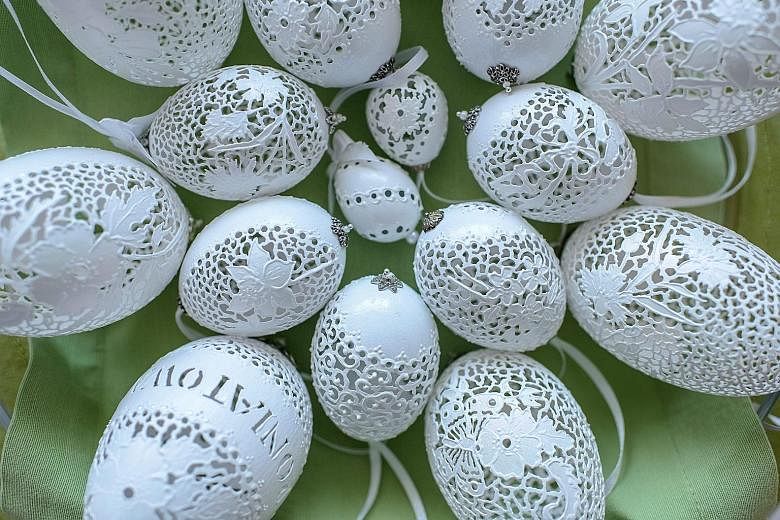 Latticed Easter eggs made by Mrs Boguslawa Justyna Golen on display in Poniatowa, eastern Poland. The design of the eggs is inspired by Venetian embroidery, says Mrs Golen, who is a member of the World Egg Artists Association.