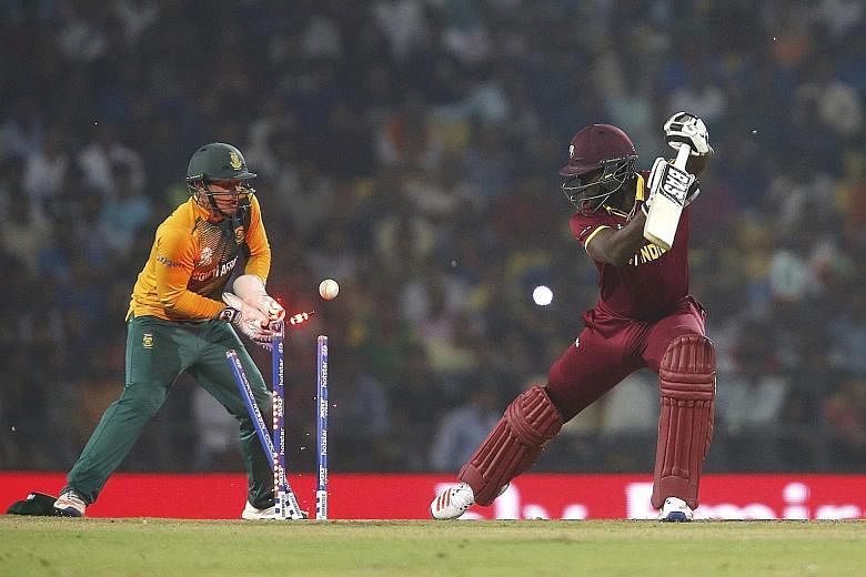 West Indies captain Darren Sammy is bowled by South Africa's Imran Tahir for a duck, leaving his side at 100-6 while chasing a target of 123. The West Indies eventually won the World Twenty20 match in Nagpur by three wickets with two balls remaining.