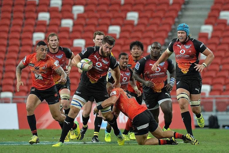 The Bulls' Nick De Jager (with ball) shrugs off a tackle by a Sunwolves opponent during yesterday's Super Rugby game. The Bulls led 23-10 at one stage, but the newcomers fought back to finish 27-30.
