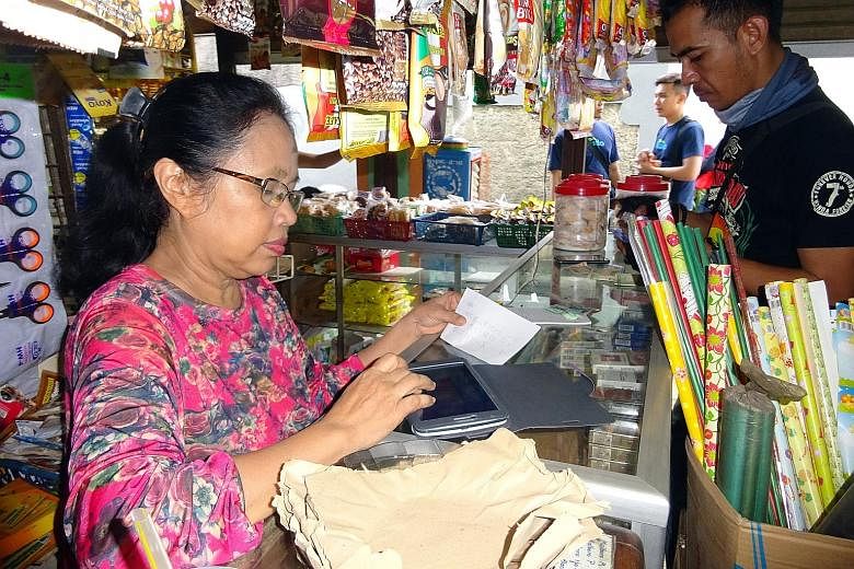 Madam Maihar, who runs a small provision shop in Jakarta, made the plunge into cyberspace four months ago when she was introduced to Kudo, a local tech start-up which allows "agents" like her to sell clothes and concert tickets from its merchant part