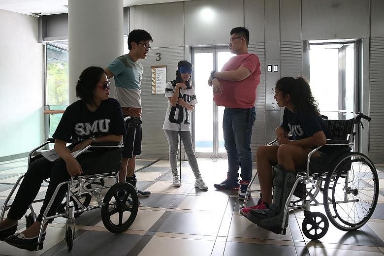 SMU students (from far left) Jean Lor, Justin Ong, Jane Wang, Ryan Hoon and Parveen Nair taking part in the simulation exercise as part of the Managing Diversity in Asia course earlier this month. It is among the university's SMU-X courses, which tea