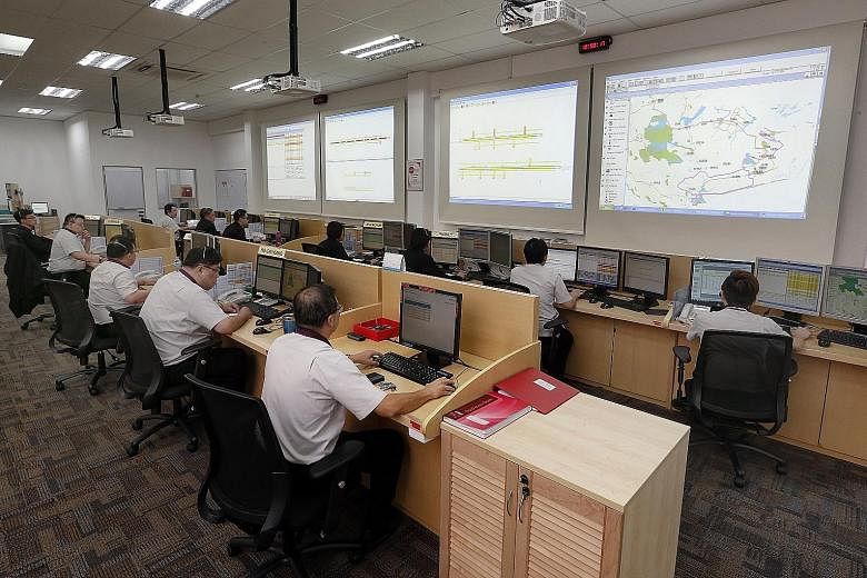 Bus service controllers at SBS Transit's operations control centre. SBS, which has a fleet of more than 3,000 buses and close to 260 bus services, currently has 70 service controllers, but expects the number to go up to about a hundred in the next tw